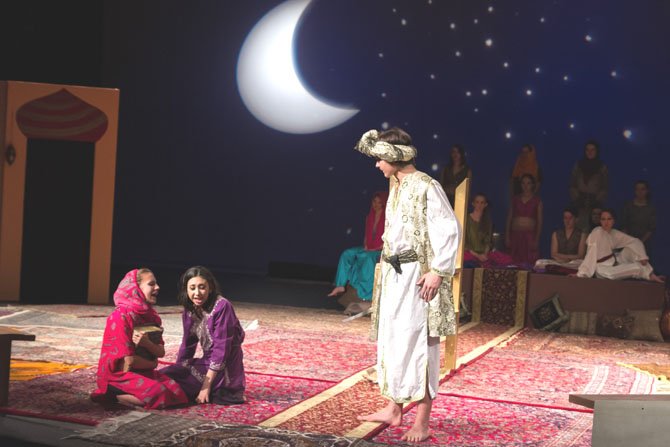 In Lake Braddock Secondary School’s production of The Arabian Nights, Elspeth Ripley, 14, as Dunyazade and Elena Dominquez, 18, as Scheherezade plead with captor Shahryar, portrayed by Tony Talcott, 14 to spare Scheherezade’s  life.