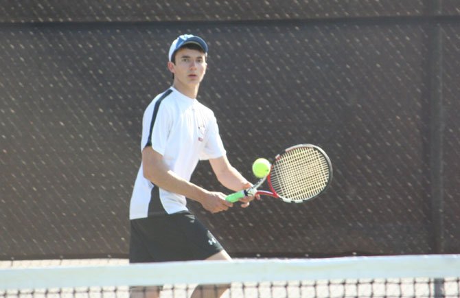 Madison High's Alex Russell (pictured) competes in his No. 6 singles match versus Langley's Brian Niu on April 16 at Madison. 