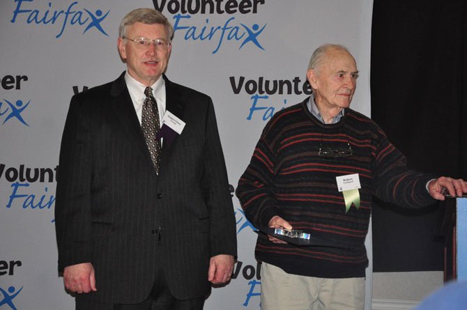 From left, Supervisor John Foust (D-Dranesville) awards Great Falls resident Bob Lundegard Community Champion for the Dranesville District Friday, April 27 at the Fairfax County Volunteer Service Awards. 