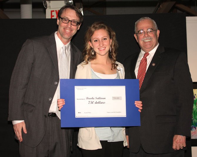 U.S. Rep. Gerry Connolly presents Brooke Sullivan of Paul VI High School 2nd prize in the congressional art competition. On the left is Scott Habes, Director of Visual Arts, Lorton Arts Foundation,