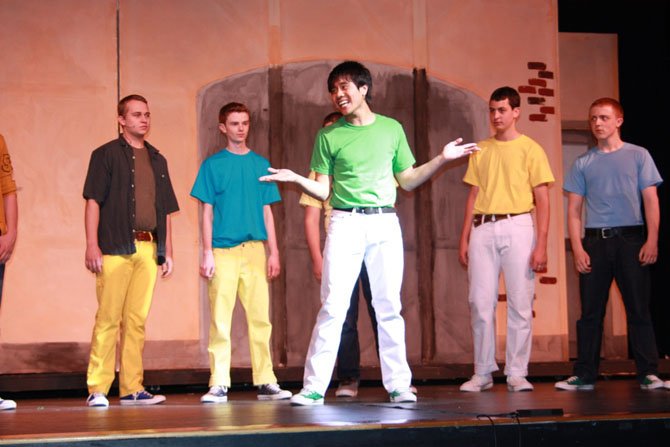 Nikko Custodio (Riff) performs "The Jet Song" while the other Jets look on (From left, back: Alex Fischer as Diesel, Jack Gereski as Action, AJ Lichstrahl as Gee-Tar, Chris Celentano as Redman).