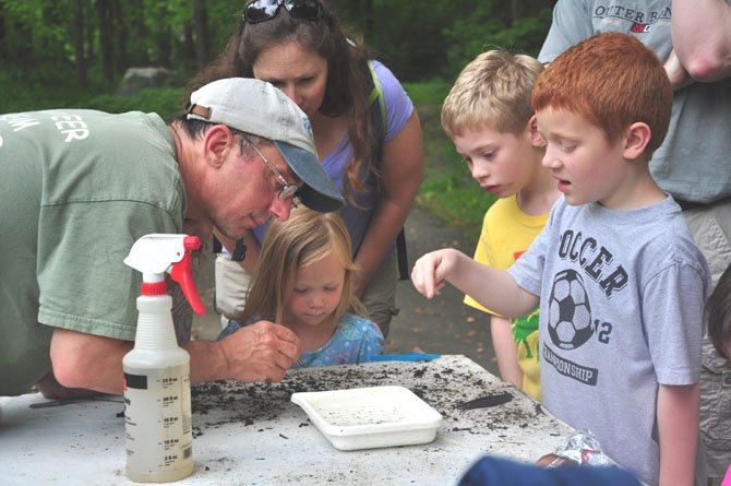 Children examine stream samples from Snakeden Branch at the Reston Spring Festival Saturday, May 5. 