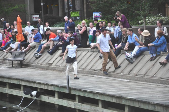 Sharon Mansur and Daniel Burkholder use the architecture of Lake Anne in their "Out of Place" performance Sunday, May 6. 