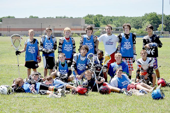 South Lakes lacrosse standout Nolan Boyle (top row, third from left), nicknamed ‘Team Nails,’ shares time with youngsters during last summer's South Lakes Lacrosse Camp.