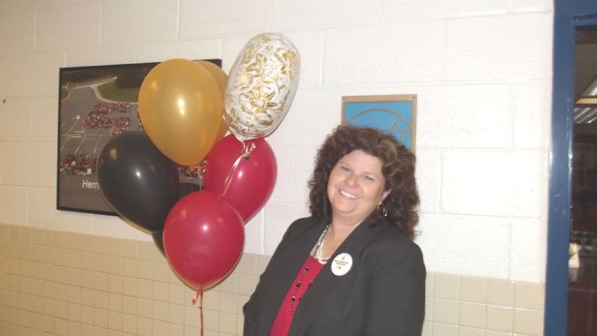 Principal Ann Gwynn celebrates her school history.