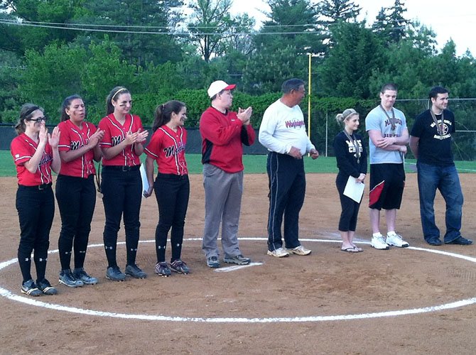 Earlier this season the Madison High girls' softball team held special ‘Teacher's Night’ festivities during pre-game ceremonies of the Warhawks' Liberty District home game versus Fairfax on April 20. Left to right, Madison High senior captains Janice Yahner, Jessica Darst, and Ally Grasso, along with freshman Allison Krisko, assist Madison Principal Mark Merrell (center) and head coach John Schneeberger (white, long sleeved shirt) in presenting the pre-game awards to the teachers.