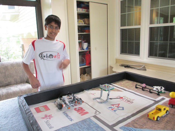 Neeraj Prasa, Vienna, practices for the FIRST LEGO® League (FLL) competition, one in which young students design robotics and solve "real-life" challenges.