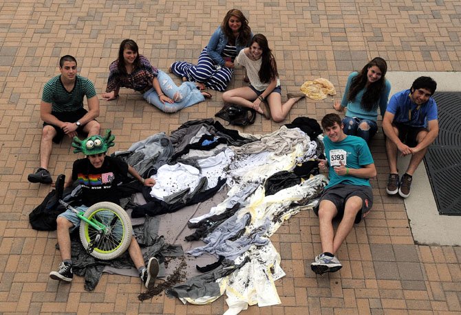 Spanish exchange student Pablo Rodriguez (bottom left) poses with his T-shirt creation of The Wolf and fellow exchange students: Christian Plugari, Zlatomir Nedeltchev, Beatriz Vasquez, Nicolas Cortes Kellems, Vijil O’Neal, Trish Brown and Laura Messerschmidt. Pablo is an exchange student in the Rotary Club program. The other students also attending T.C. Williams are part of the American Field Service Program and the Future Leaders Exchange Program.
