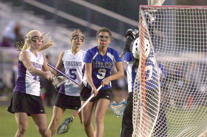 The Lake Braddock Secondary girls’ lacrosse team, shown here in a Patriot District meeting versus T.C. Williams, is the No. 1-seed at the district tournament, which began last Friday and is continuing this week.