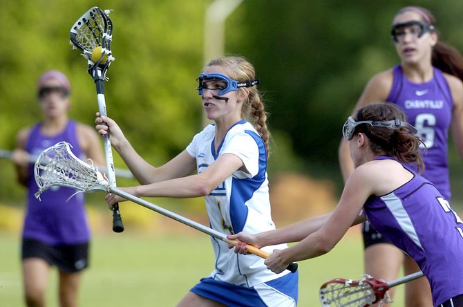 Robinson's Maggie Hyland protects the ball from a Chantilly defender. The sophomore was one of three Rams players to score five goals in last Friday's playoff win over the Chargers.