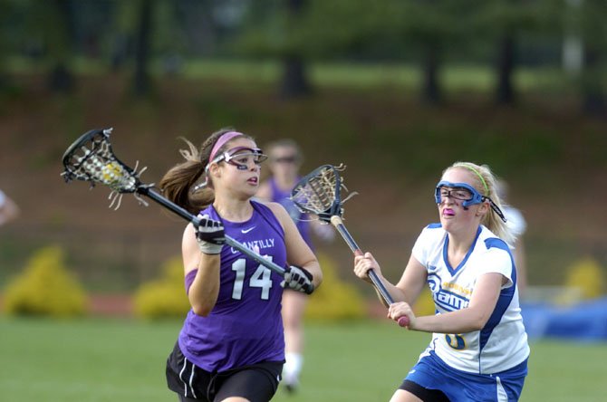 Chantilly High girls’ lacrosse player Bridget Cleary looks to make a move with the ball during the Chargers’ Concorde District quarterfinals playoff game at Robinson last Friday evening. 