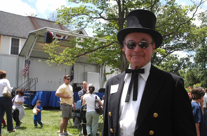 Tommy Lukas with his signature top hat and tails, greeted and entertained McLean Day participants on the McLean Day stage for 19 years.