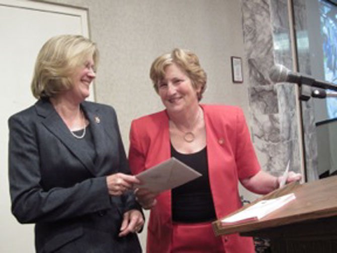 Receiving an award, Ann Levy, "Woman of the Year" (left), from Carolyn Cass (right), current WRJ President.
