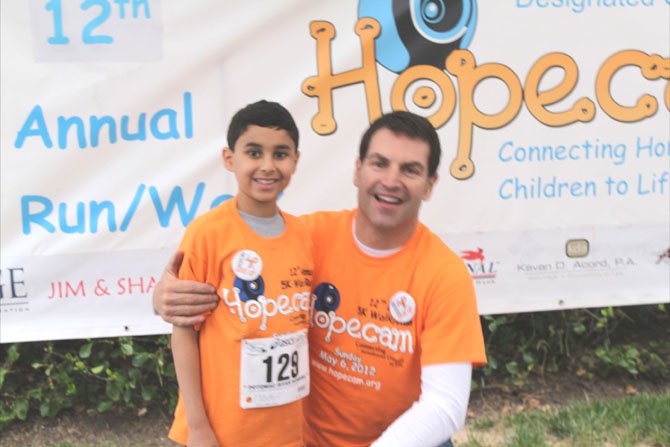 One of the runners was Hopecam’s honored guest, Stefano Rocca, 8, (pictured with Hopecam Founder, Len Forkus). Stefano is a 2nd grader at Westbriar Elementary School in Vienna who has been battling leukemia since being diagnosed in February 2011. During his 10 months of initial treatment, Stefano was not able to attend school, have play dates, go to a movie, restaurant, birthday parties because of his reduced immune system. 