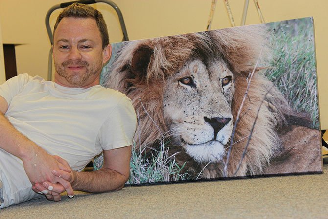 Timothy Forbes with his artwork.
