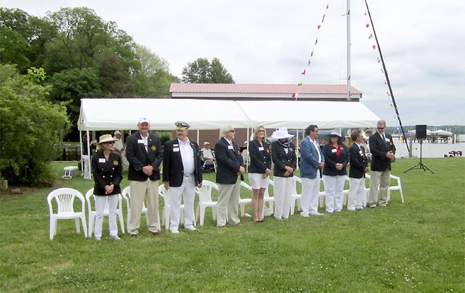 MVYC Officers bow their heads at the annual "Blessing of the Fleet," presented this year by Chaplain Ruth Walsh of St. James Episcopal Church on Old Mill Road. 
