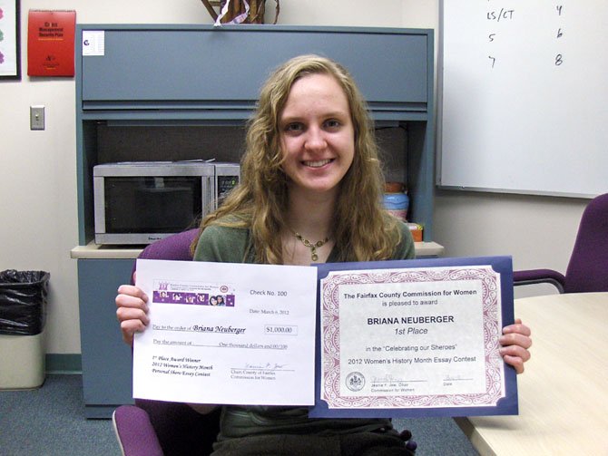 Chantilly senior Briana Neuberger shows her first-place award and replica of her scholarship check.