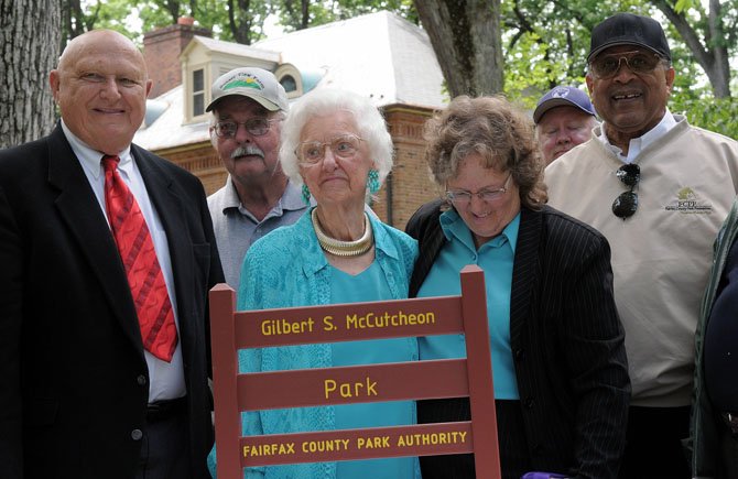 Mount Vernon Supervisor Gerry Hyland Frances and Bonnie McCutcheon, Richard Settle, William Bouie and others join in for the unveiling of the new sign designating the park as the Gilbert S. McCutcheon Park.