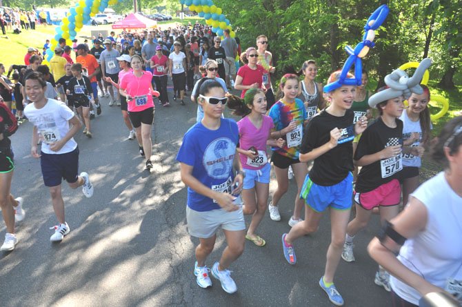 Runners take off from the finish line at the start of the third annual Joe Cassella 5K in Great Falls Sunday, May 20. 