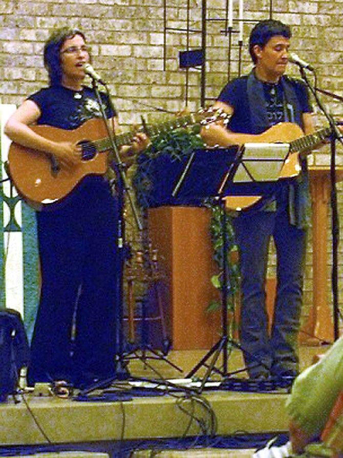 Sandy O and Pat Humphries of Emma’s Revolution perform at the Unitarian Universalist Church of Arlington.
