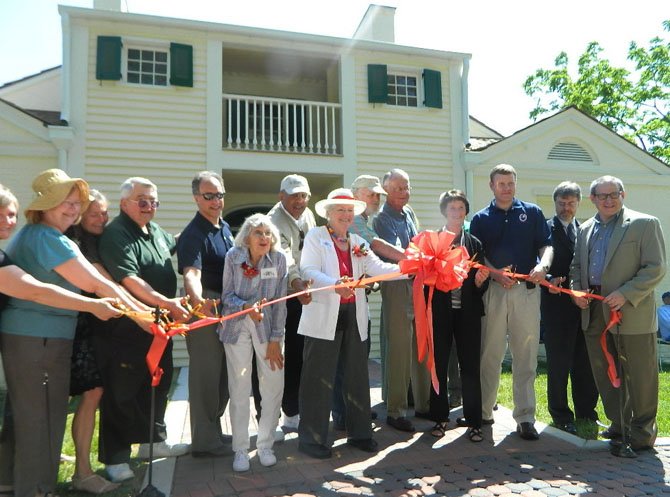 The ribbon-cutting, led by Barbara Ballentine and Board of Supervisors Chairman Sharon Bulova, took place in the back of the house where the ground is level.