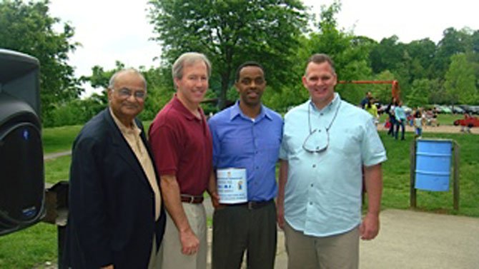 Tufail Ahmed, Council member Phil Andrews, Guled Kassim and Jim Perkins, Regional Director Giant.