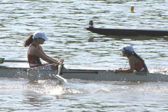 Coxswain Kathrina Policarpio shouts out commands to rower Maeve Bradley as she and other members of the T.C. Williams girls’ freshman 8 race toward the finish line during their semifinal heat at the Stotesbury Cup Regatta on the Schuylkill River in Philadelphia on May 19. The freshman girls placed second in their heat to advance to the final of the event.  