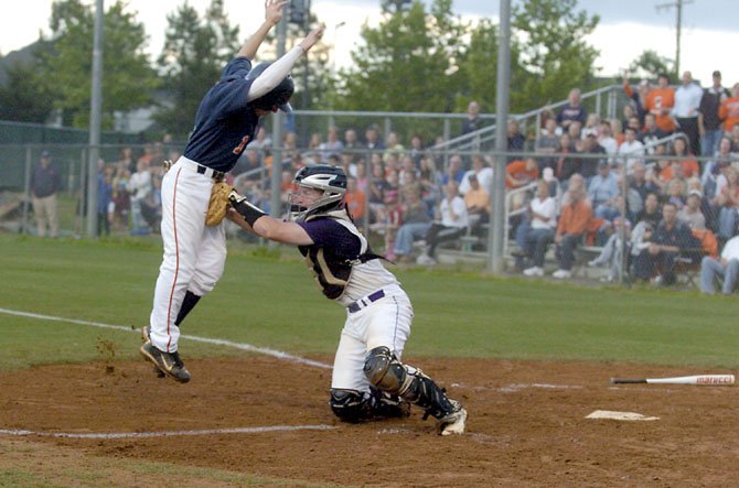 Lake Braddock catcher Garett Driscoll tags out West Springfield’s Taylor Boyd during the third inning of the Patriot District championship game on May 21.