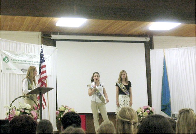 Master of Ceremony Katelyn Moore, 16, of Burke honors silver award recipients Allison Howl, 17, and Claire Schindler, 17, both of Springfield.