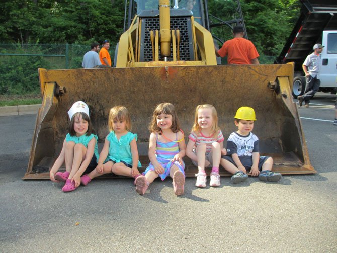 The only thing that is more fun than sitting in the cab of a front loader is sitting inside the front loader.

