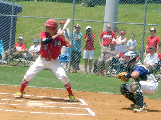 McLean High’s Joey Sullivan (batting) made a key late game defensive play and also hit a game-tying double for the Highlanders in their extra innings region playoff game loss at Lake Braddock on Memorial Day. 