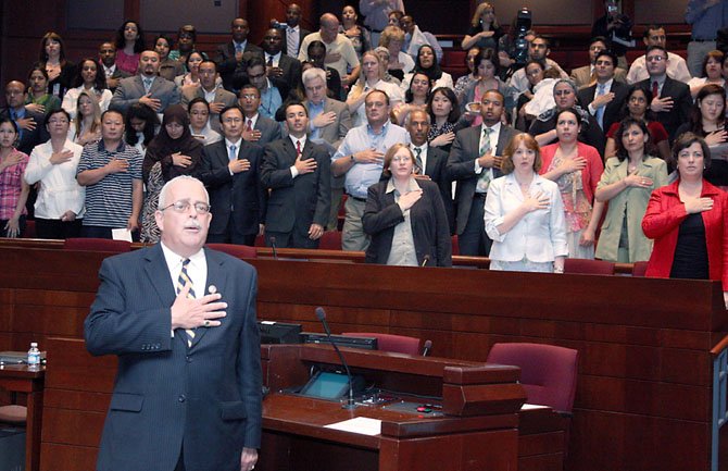 Rep. Gerry Connolly (D-11) leads 75 new U.S. citizens from 33 countries in Pledge of Allegiance at Friday’s naturalization ceremony at the Fairfax County Government Center.  In his remarks, Connolly told the newly-minted citizens "you are as American as I am."