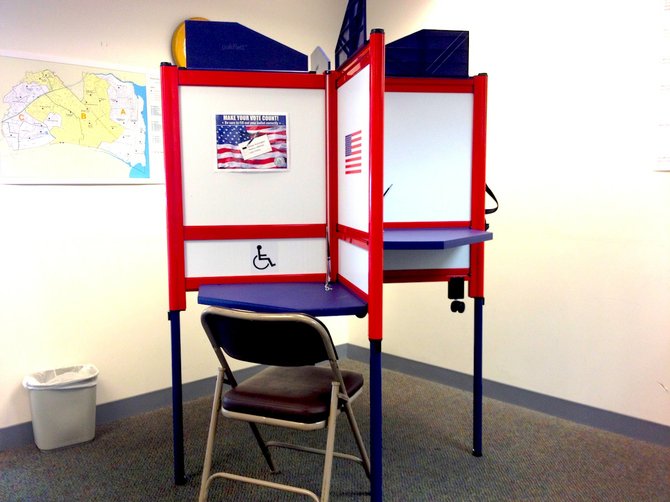 New voting booths on display at the registrar's office.