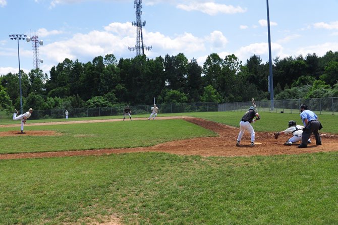 The Langley High School varsity baseball team pitches to a team of Langley alumni Saturday, June 2 at Nike Field. 