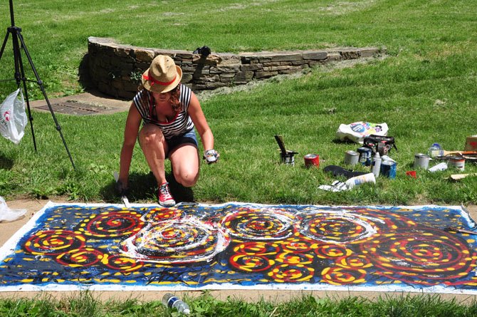 Artist Christine Walters works on a piece in McLean Central Park, as part of the McLean Project for the Arts’ "Painting in the Park" event Sunday, June 3. 