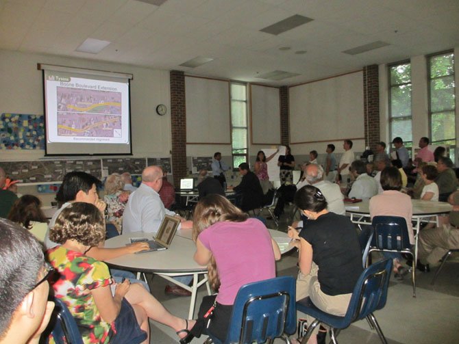 Pam Konde’, president of the Greater Tysons Green Civic Association, speaks on behalf of preserving the protected Environmental Quality Corridor at Tysons Corner. FCDOT proposed an option to cut through Tysons’ last remaining forest to build a road extending Boone Boulevard to the Dulles Toll Road.