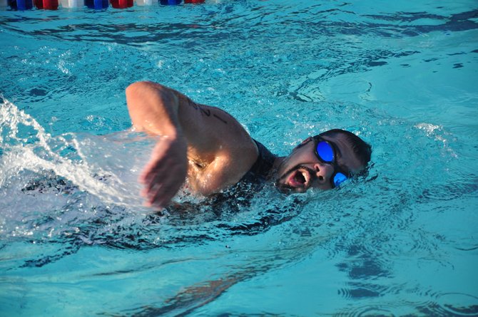 Robert Marzban competes in the quarter-mile swim, the first part of the Reston Sprint Triathlon Sunday, June 3 at the Lake Newport Pool. 