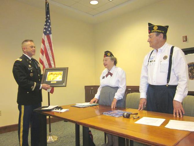 During a visit to Greenspring Retirement Village in April, U.S. Army Col. David J. Clark, chairman of the 60th Korean War anniversary committee, presents a commemoration plaque to Libby Haynes and Peter Straub, a Greenspring resident and Vice Commander of American Legion Greenspring Post 123. Haynes is the Adjutant and treasurer for the American Legion Greenspring Post 123. Other residents who received certificates for their service in the Korean War were: Wanda Driver, Dureta Wiecjorek, Mary Cormier, Jane Ford, Gail Reals, and Margaret Brewer.

