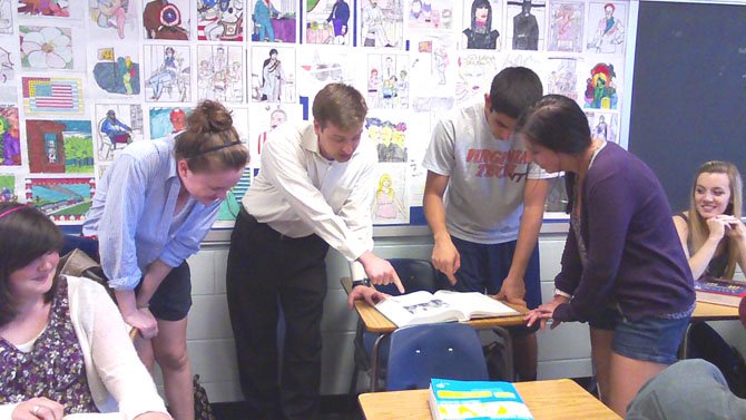 Brian Heintz (center) poses with his West Springfield High School students.

