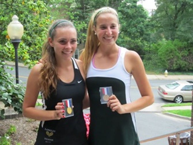 Langley High girls' tennis players Sydney Goodson and Kathryn Emery teamed up to win this spring's Northern Region doubles tournament championship. Here, the winning teammates display their championship medals.