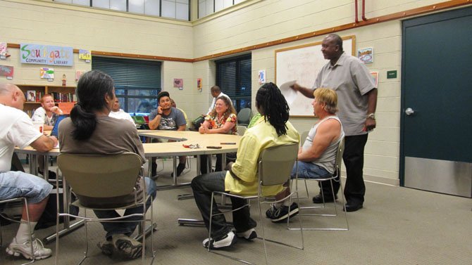 Social worker Calvin Robertson, with Fairfax County’s Department of Family Services, teaches the Fathers in Touch class at South Gate Community Center in Reston. The 12-week program, a partnership with Fairfax County and the Capital Youth Empowerment Program (CYEP) in Alexandria, helps men become more engaged and loving fathers.