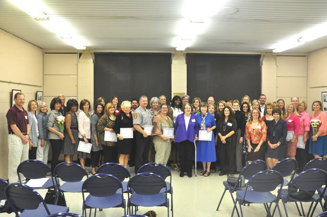 Partners of the Safe Community Coalition, which includes schools, businesses, faith communities and government and safety workers, are recognized at the SCC’s annual members meeting at the McLean Community Center Tuesday, June 5. 