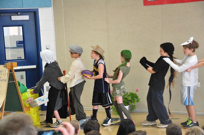 Third graders in the Japanese Immersion Program at Great Falls Elementary School present the play "The Enormous Turnip" as part of their end-of-the-year celebration Friday, June 8. 