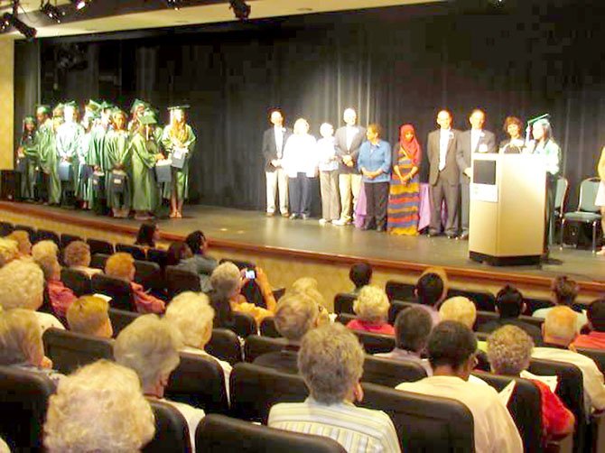 Rendha Maharosa speaks to her fellow Greenspring Scholars at a May 23 ceremony at the Springfield retirement community. The 19 scholarship candidates for 2012 were dressed in cap and gown and recognized for their commitment and service to the Greenspring community. 