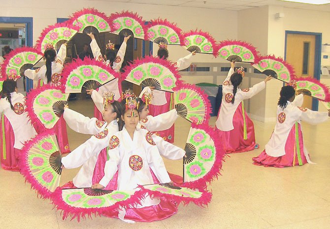 Students perform a Korean fan dance during the Fairfax Academy’s Creative Works Showcase.