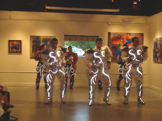 Bolivian Dance group, Caporales San Simon performing in the gallery.

