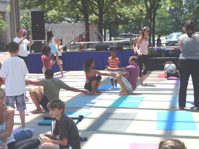 Instructor from Bikram of Great Falls teaching Bikram to patrons at the event.