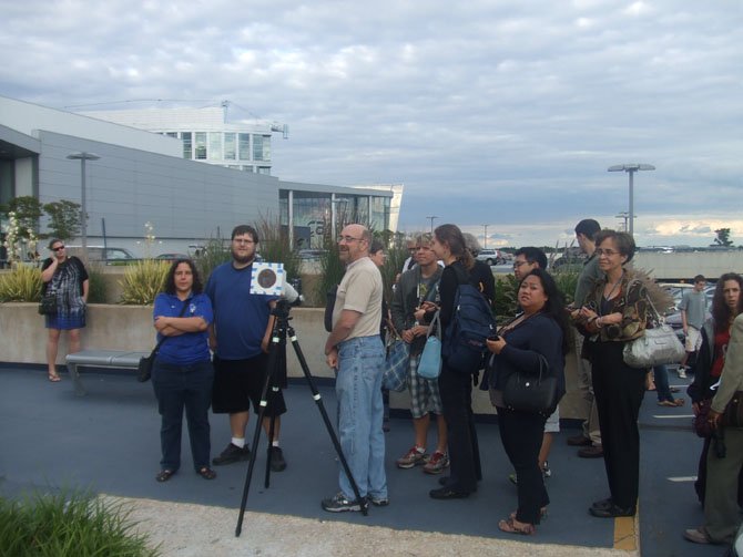 Science lovers set up their telescopes in hopes of catching the rare spectacle.  