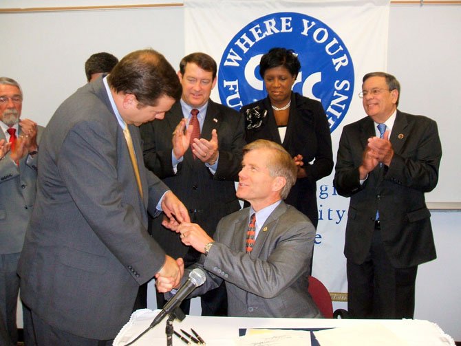 Gov. Robert F. McDonnell sat bill signing to reduce or repeal unfunded mandates on local government.