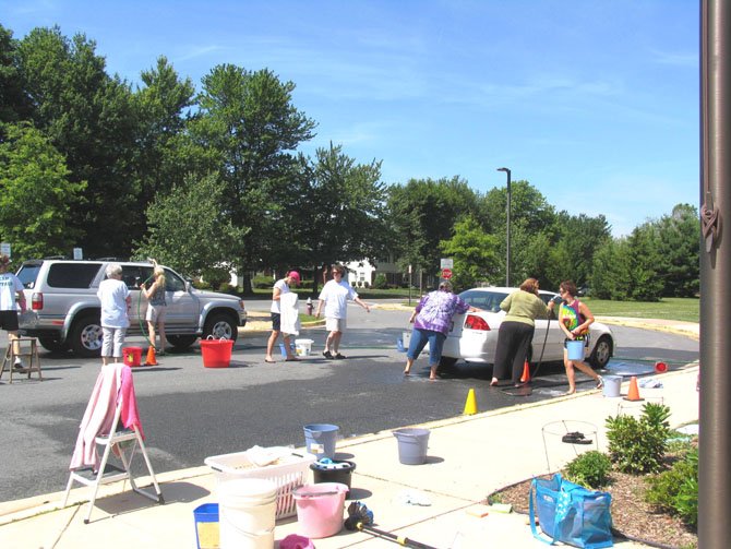 Greenbriar West Elementary staff and students wash cars.